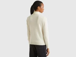 Cream turtleneck sweater in pure Merino wool