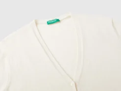 Creamy white V- neck cardigan in pure Merino wool