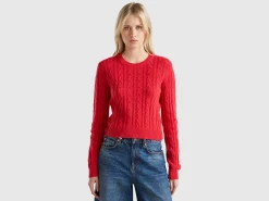 Cropped sweater with cable knit and perforations