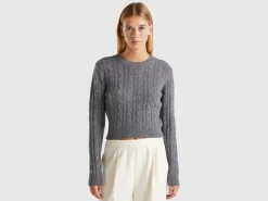 Cropped sweater with cable knit and perforations