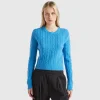 Cropped sweater with cable knit and perforations