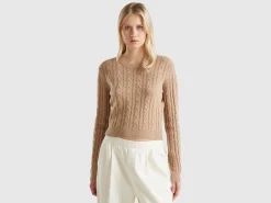 Cropped sweater with cable knit and perforations