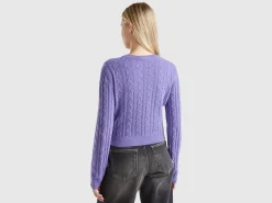 Cropped sweater with cable knit and perforations