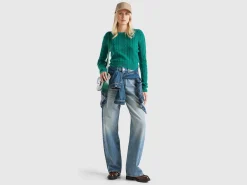 Cropped sweater with cable knit and perforations