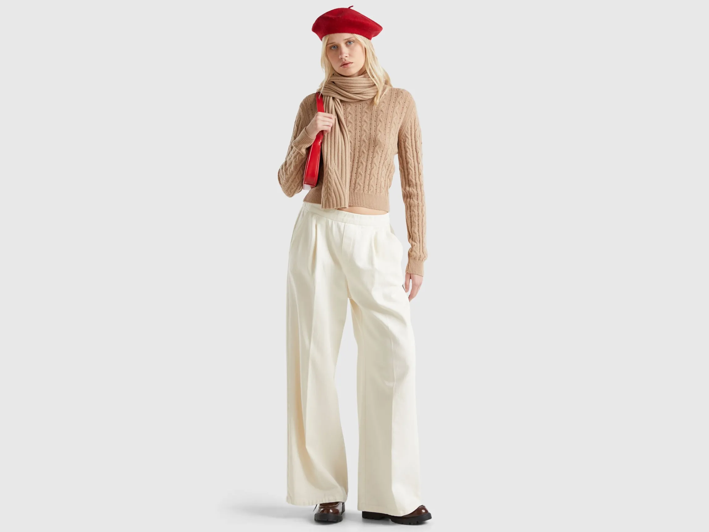 Cropped sweater with cable knit and perforations