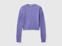 Cropped sweater with cable knit and perforations