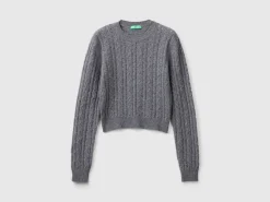 Cropped sweater with cable knit and perforations