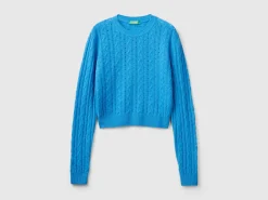 Cropped sweater with cable knit and perforations