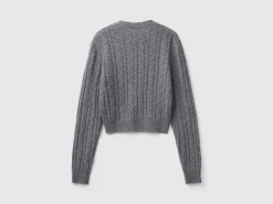 Cropped sweater with cable knit and perforations