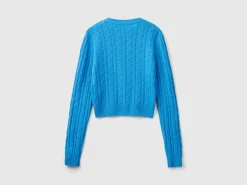 Cropped sweater with cable knit and perforations