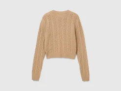 Cropped sweater with cable knit and perforations