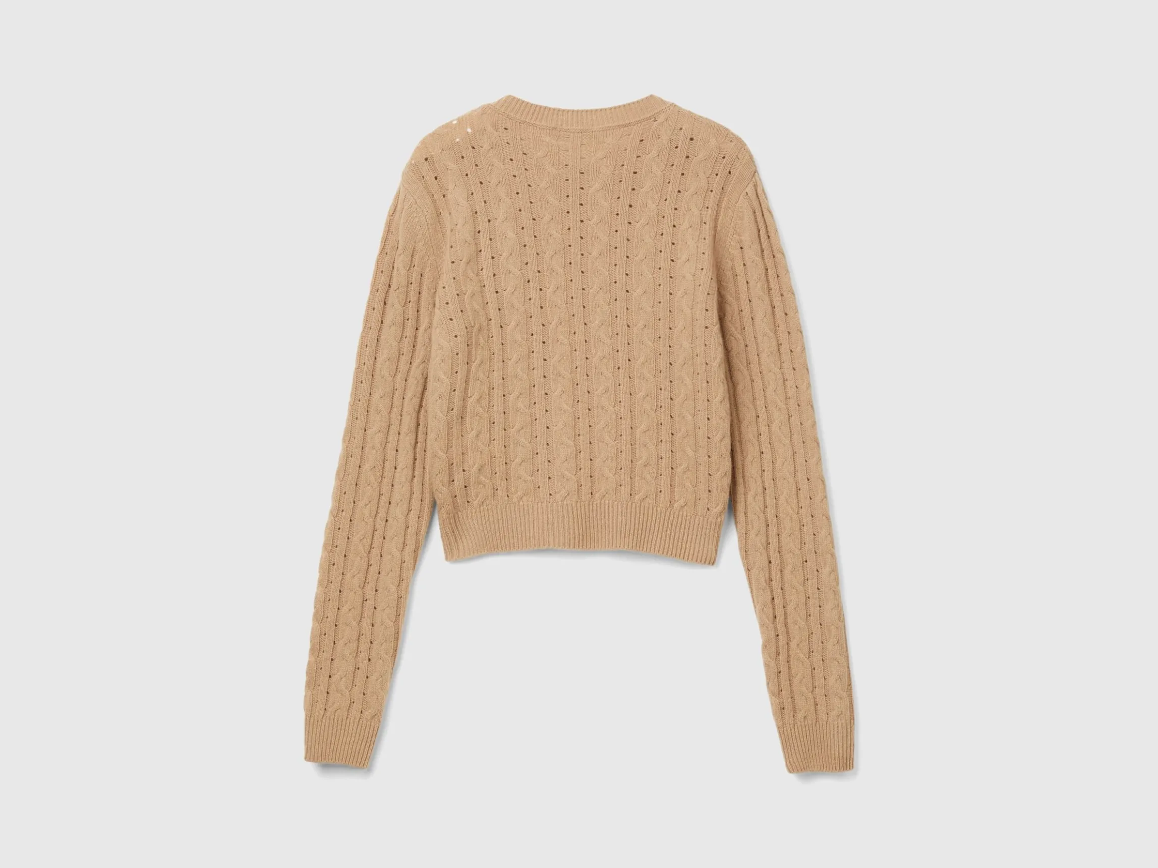 Cropped sweater with cable knit and perforations