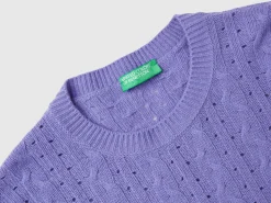 Cropped sweater with cable knit and perforations