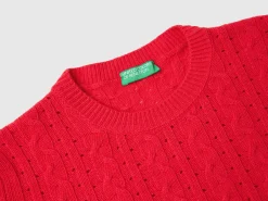 Cropped sweater with cable knit and perforations