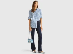 Flared jeans in recycled cotton blend