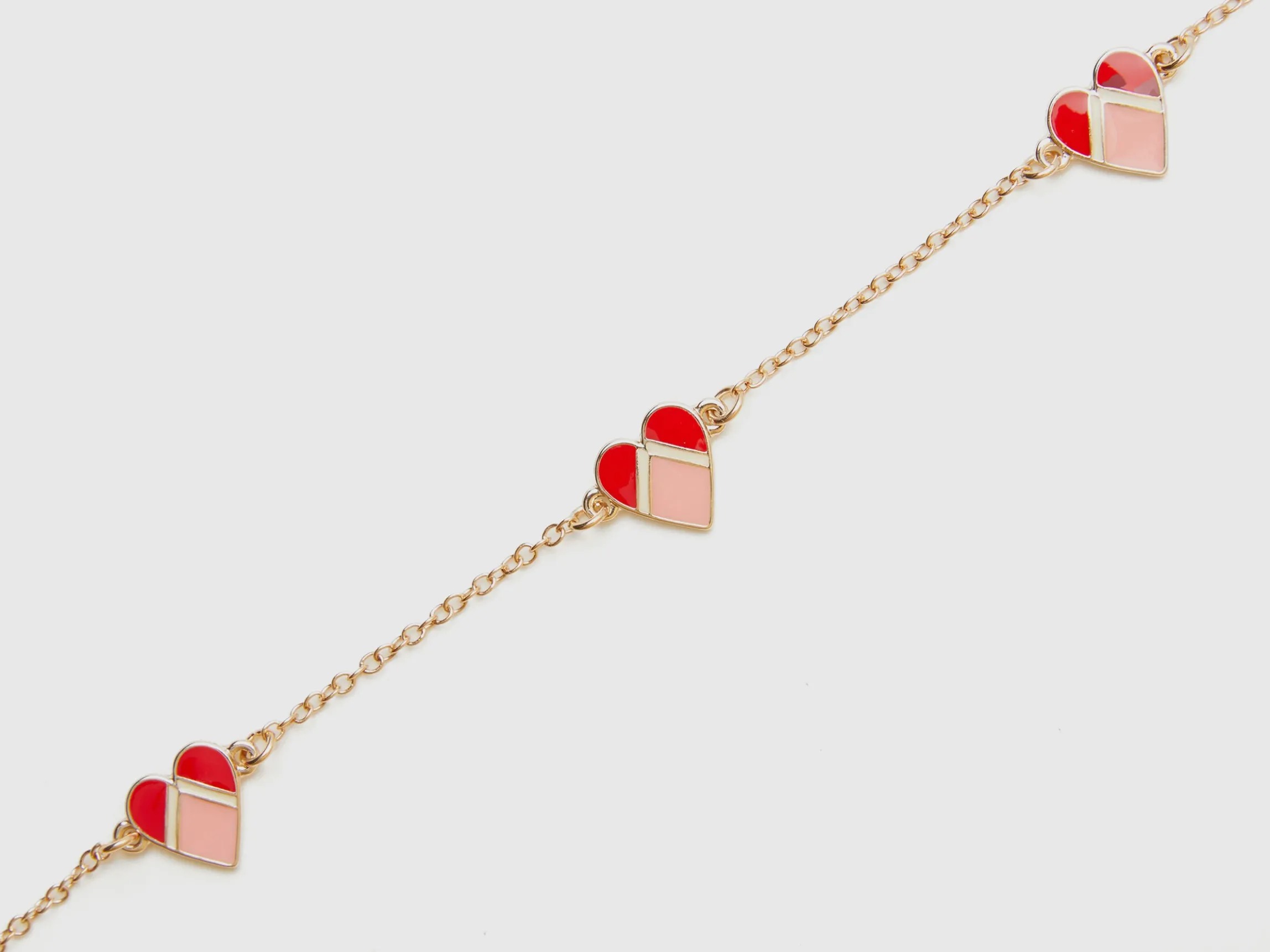 Gold necklace with hearts