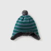 Hat with earflaps and pom pom