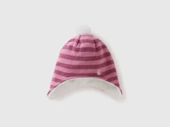 Hat with earflaps and pom pom
