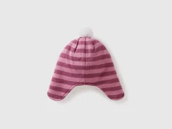 Hat with earflaps and pom pom
