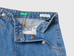 Jeans with jewel effect applique