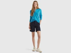 Light blue crew neck cardigan in pure Merino wool