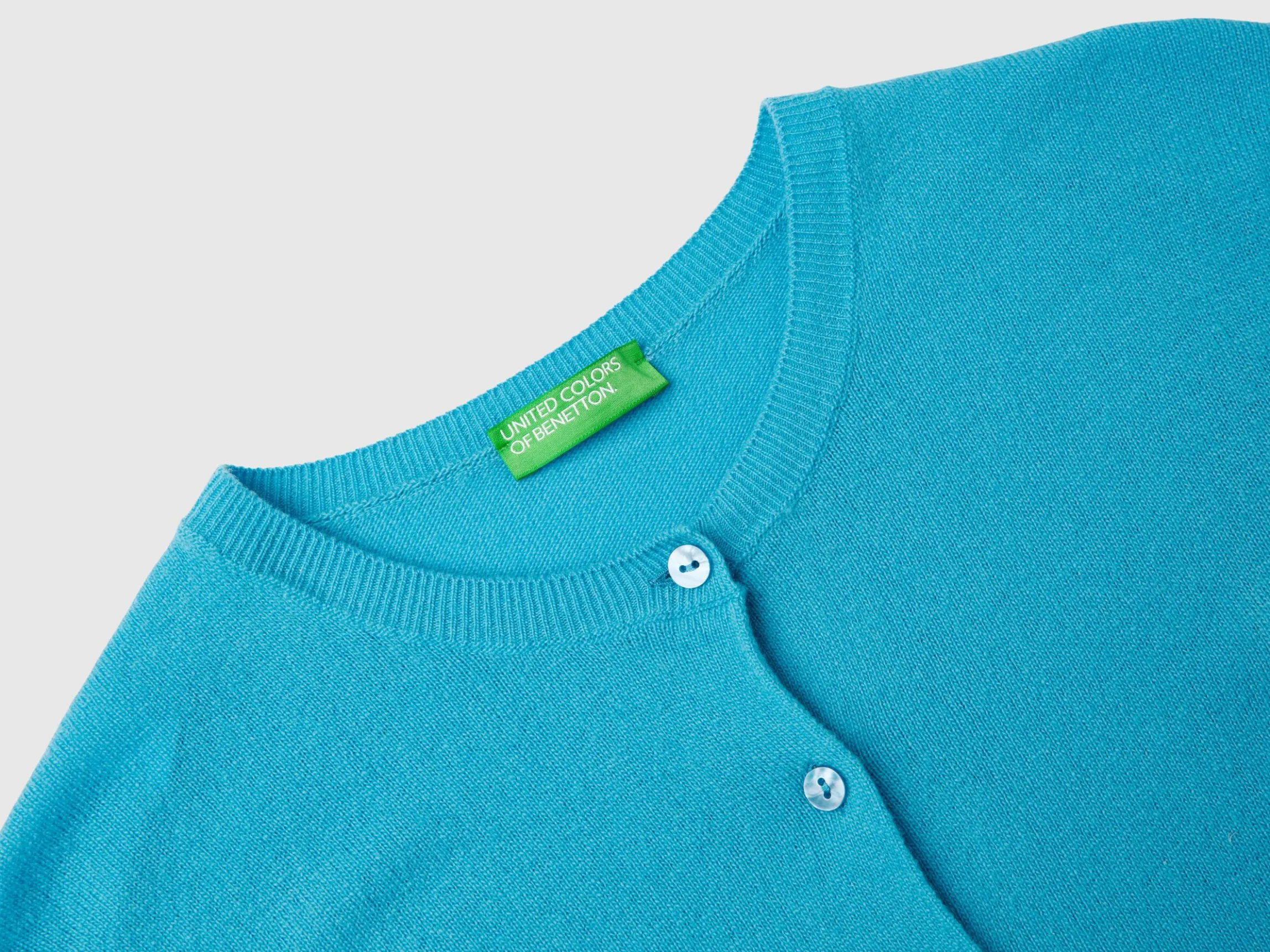 Light blue crew neck cardigan in pure Merino wool