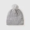 Lined hat with pom pom