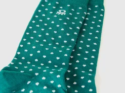 Long socks with green hearts