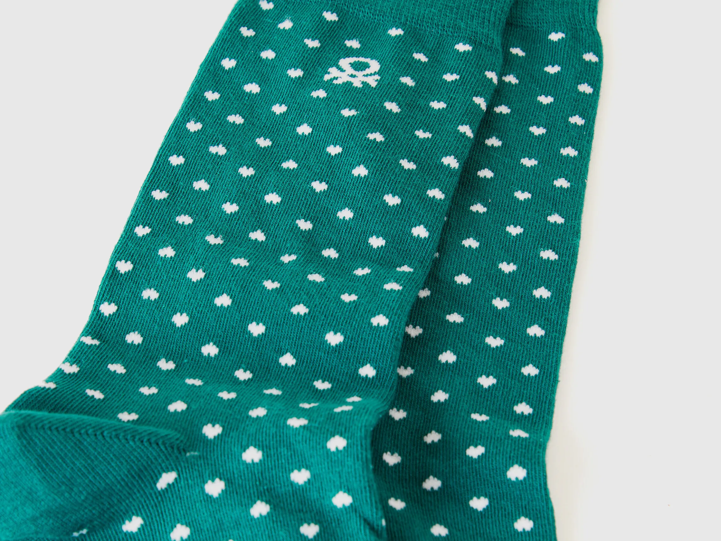 Long socks with green hearts