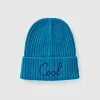 Neon light blue beanie with embroidery