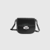 Small crossbody bag in synthetic patent leather