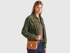 Small crossbody bag in synthetic patent leather