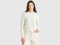 Sweater with cable knit and rhinestones