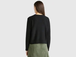 Sweater with cable knit and rhinestones
