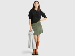 Sweater with cable knit and rhinestones