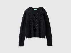 Sweater with cable knit and rhinestones