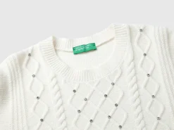 Sweater with cable knit and rhinestones