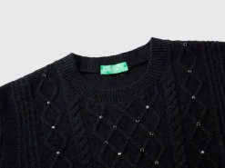 Sweater with cable knit and rhinestones