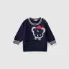 Sweater with embroidery and applique