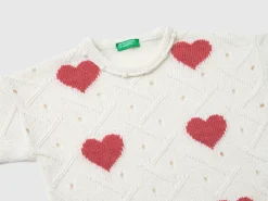 Sweater with heart inlay