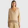 Sweater with opening at back