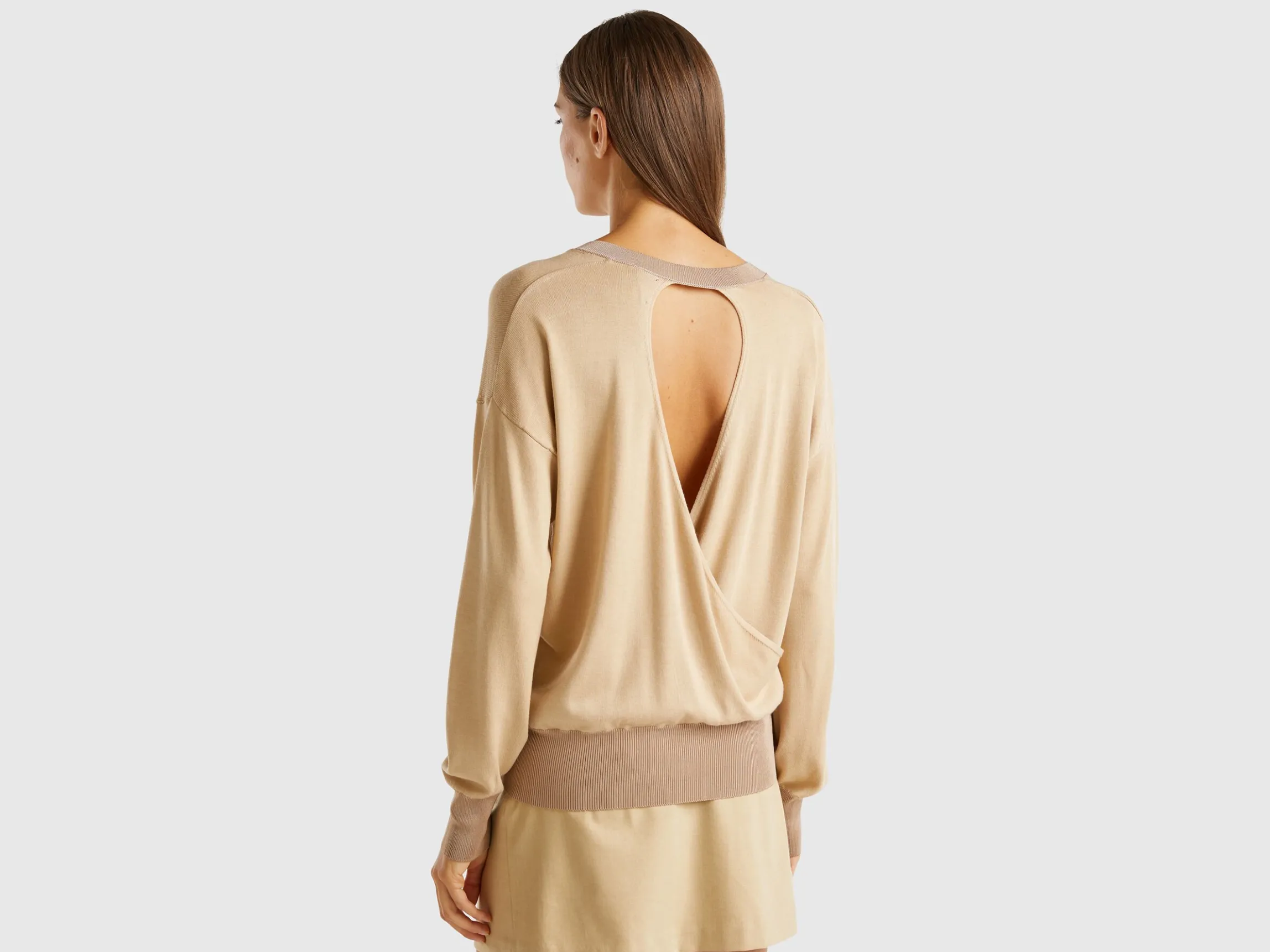 Sweater with opening at back