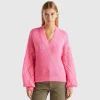Sweater with perforated sleeve
