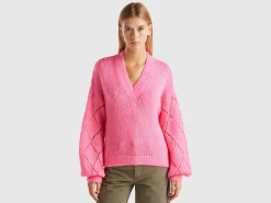 Sweater with perforated sleeve
