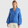 Sweater with perforated sleeve