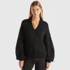 Sweater with perforated sleeve