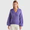 Sweater with perforated sleeve
