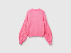 Sweater with perforated sleeve