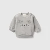 Sweatshirt with embroidery and patches in organic cotton
