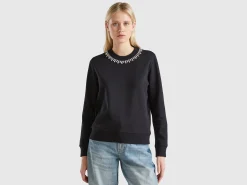Sweatshirt with jewel effect applique